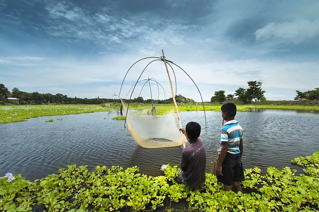 Small kids are fishing, Why visit Northeast India